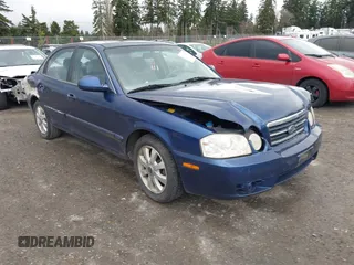 2005 Kia Optima LX z VIN KNAGD128555431730, wystawiony jako IAAI lot #41795080 z przebiegiem 120 624 mil mil oraz . Historia ofert i sprzedaży dostępna na DreamBid. Obrazek 1.