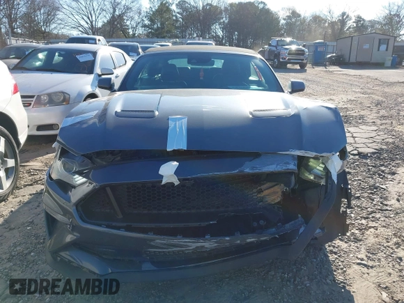 2021 Ford Mustang EcoBoost z VIN 1FATP8UH3M5105279, wystawiony jako IAAI lot #41712821 z przebiegiem 99 760 mil mil oraz . Historia ofert i sprzedaży dostępna na DreamBid. Obrazek 12.