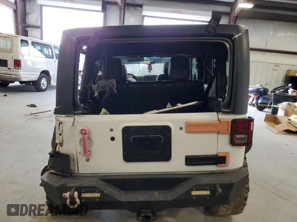 2016 Jeep Wrangler Unlimited Freedom with VIN 1C4BJWDG9GL199557, listed as a Copart auction lot 59421835 with 171,838 mi miles and Salvage title. Bid and sale history available at DreamBid. Image 6.