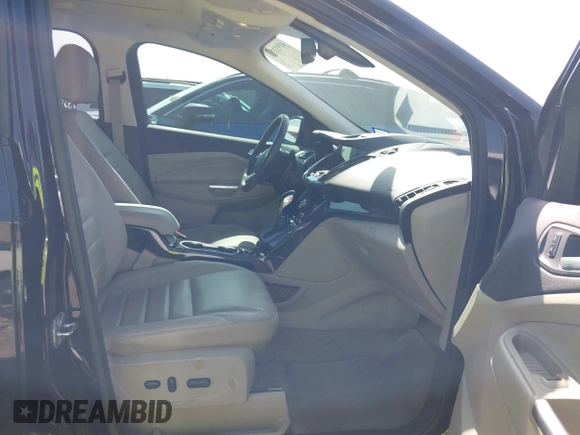 2016 Ford Escape Titanium with VIN 1FMCU0JX5GUC88013, listed as a IAAI auction lot 41933751 with 77,789 mi miles. Bid and sale history available at carsss.com. Image 5.