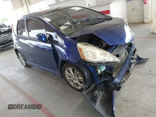 2009 Honda Fit Sport z VIN JHMGE884X9S053746, wystawiony jako IAAI lot #42187652 z przebiegiem 169 877 mil mil oraz . Historia ofert i sprzedaży dostępna na DreamBid. Obrazek 1.