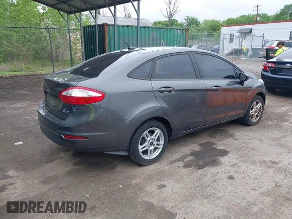 2019 Ford Fiesta SE z VIN 3FADP4BJ7KM155094, wystawiony jako IAAI lot #42186126 z przebiegiem 93 684 mil mil oraz . Historia ofert i sprzedaży dostępna na DreamBid. Obrazek 4.