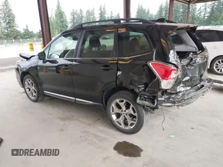 2018 Subaru Forester Touring with VIN JF2SJAWC2JH598982, listed as a IAAI auction lot 42455652 with 57,254 mi miles and . Bid and sale history available at DreamBid. Image 3.