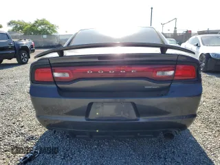 2013 Dodge Charger SE z VIN 2C3CDXBG6DH636433, wystawiony jako Copart lot #57604175 z przebiegiem 216 750 mil mil oraz Tytuł czysty. Historia ofert i sprzedaży dostępna na DreamBid. Obrazek 6.