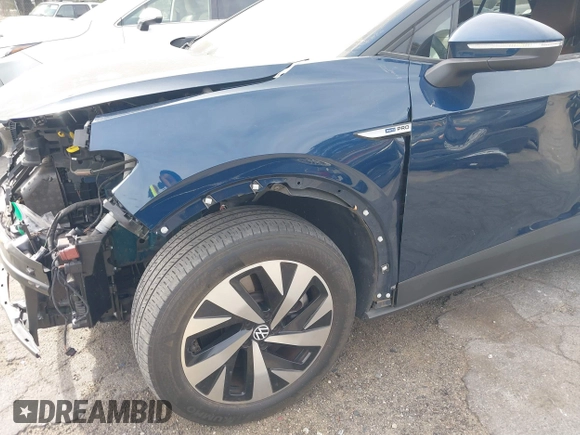 2023 Volkswagen ID.4 Pro z VIN 1V2DNPE8XPC019169, wystawiony jako IAAI lot #41313501 z przebiegiem 32 552 mil mil oraz . Historia ofert i sprzedaży dostępna na DreamBid. Obrazek 6.