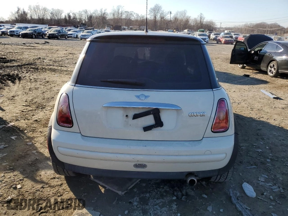2004 MINI Hardtop with VIN WMWRC334X4TJ54215, listed as a Copart auction lot 46860695 with Not Provided miles and Salvage Title. Bid and sale history available at DreamBid. Image 6.