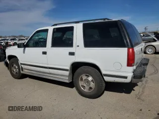 1999 GMC Yukon with VIN 1GKEK13R4XJ751482, listed as a Copart auction lot 48035075 with 154,800 mi miles and Salvage Title. Bid and sale history available at carsss.com. Image 2.