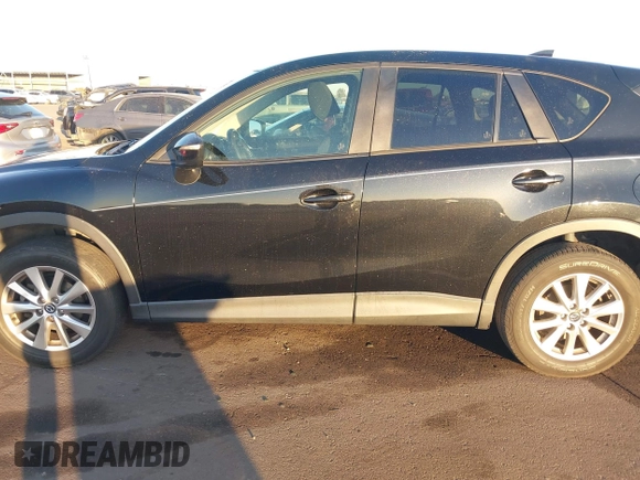 2016 Mazda CX-5 Touring with VIN JM3KE2CY5G0704574, listed as a IAAI auction lot 41033546 with 133,502 mi miles. Bid and sale history available at carsss.com. Image 14.