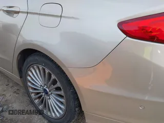 2017 Ford Fusion Titanium z VIN 3FA6P0SU5HR373140, wystawiony jako IAAI lot #41082406 z przebiegiem 98 422 mil mil oraz . Historia ofert i sprzedaży dostępna na DreamBid. Obrazek 17.