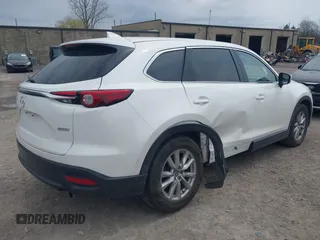 2017 Mazda CX-9 Sport with VIN JM3TCBBY3H0139514, listed as a IAAI auction lot 42082162 with 54,077 mi miles and . Bid and sale history available at DreamBid. Image 4.