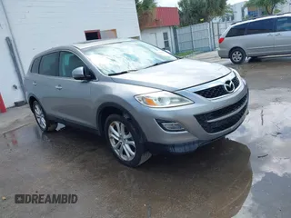 2011 Mazda CX-9 Grand Touring z VIN JM3TB2DA8B0307271, wystawiony jako IAAI lot #41896962 z przebiegiem 144 624 mil mil oraz . Historia ofert i sprzedaży dostępna na DreamBid. Obrazek 1.