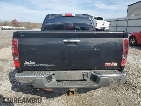 2011 GMC Canyon SLE1 z VIN 1GTH6MFE7B8108339, wystawiony jako Copart lot #79999954 z przebiegiem Nie podano mil oraz Szkoda całkowita • Salvage title. Historia ofert i sprzedaży dostępna na DreamBid. Obrazek 6.