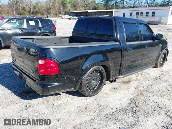 2002 Ford F-150 Harley Davidson with VIN 1FTRW07312KC24102, listed as a IAAI auction lot 41591917 with 1 mi miles. Bid and sale history available at carsss.com. Image 4.