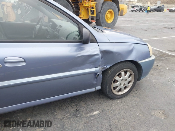 2003 Kia Rio with VIN KNADC125736236506, listed as a IAAI auction lot 41467649 with 109,975 mi miles. Bid and sale history available at carsss.com. Image 6.