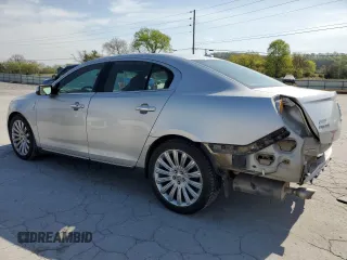 2013 Lincoln MKS with VIN 1LNHL9EK0DG612314, listed as a Copart auction lot 52901685 with 124,828 mi miles and Salvage title. Bid and sale history available at DreamBid. Image 2.