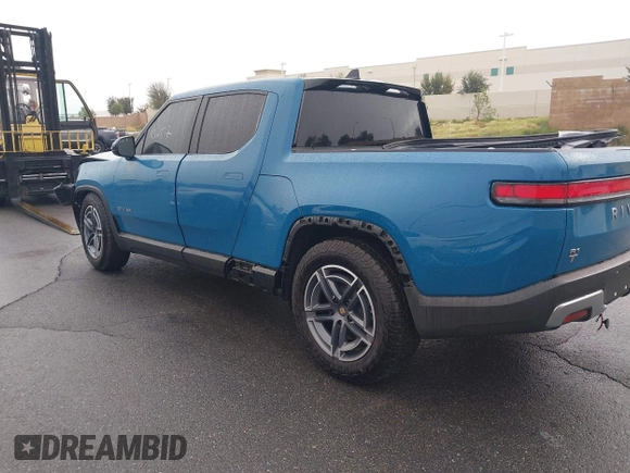 2025 Rivian R1T Adventure z VIN 7FCTGBAA9SN035986, wystawiony jako IAAI lot #41510257 z przebiegiem 2 102 mil mil oraz . Historia ofert i sprzedaży dostępna na DreamBid. Obrazek 3.