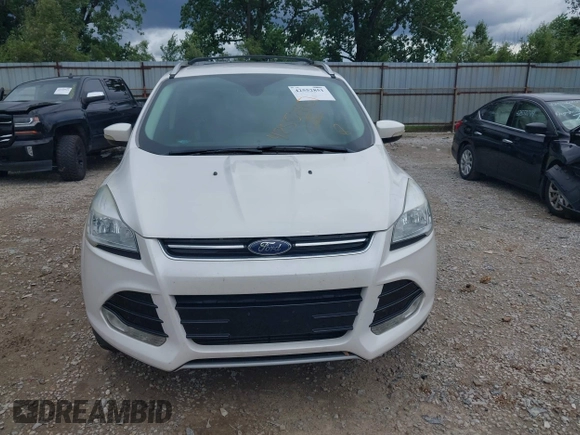 2016 Ford Escape Titanium z VIN 1FMCU9J90GUC76504, wystawiony jako IAAI lot #42552851 z przebiegiem 89 570 mil mil oraz . Historia ofert i sprzedaży dostępna na DreamBid. Obrazek 6.
