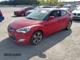 2012 Hyundai Veloster w/Black Int with VIN KMHTC6AD4CU077164, listed as a IAAI auction lot 42053970 with 122,657 mi miles. Bid and sale history available at carsss.com. Image 2.