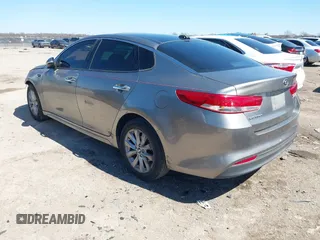 2016 Kia Optima EX with VIN 5XXGU4L31GG106854, listed as a IAAI auction lot 41762052 with 122,121 mi miles. Bid and sale history available at carsss.com. Image 3.