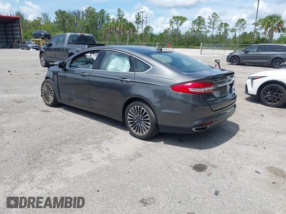 2018 Ford Fusion Titanium with VIN 3FA6P0D9XJR169657, listed as a IAAI auction lot 42392112 with 62,754 mi miles and . Bid and sale history available at DreamBid. Image 3.