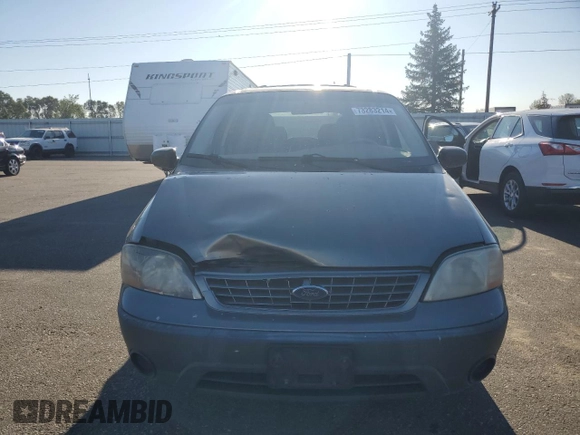 2001 Ford Windstar LX z VIN 2FMZA51441BA35669, wystawiony jako Copart lot #73283214 z przebiegiem 240 538 mil mil oraz Szkody całkowita. Historia ofert i sprzedaży dostępna na DreamBid. Obrazek 5.