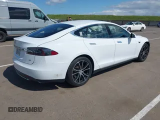 2014 Tesla Model S 60 with VIN 5YJSA1H10EFP56526, listed as a IAAI auction lot 41871784 with 143,361 mi miles and . Bid and sale history available at DreamBid. Image 4.