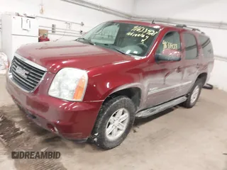 2011 GMC Yukon SLT with VIN 1GKS2CE08BR308792, listed as a IAAI auction lot 41633427 with 216,483 mi miles. Bid and sale history available at carsss.com. Image 2.