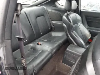 2003 Hyundai Tiburon GT z VIN KMHHN65F13U068658, wystawiony jako Copart lot #81799404 z przebiegiem 163 148 mil mil oraz Szkoda całkowita • Salvage title. Historia ofert i sprzedaży dostępna na DreamBid. Obrazek 10.