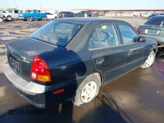 2005 Hyundai Accent GLS with VIN KMHCG45C75U632587, listed as a IAAI auction lot 40946829 with 114,666 mi miles. Bid and sale history available at carsss.com. Image 4.