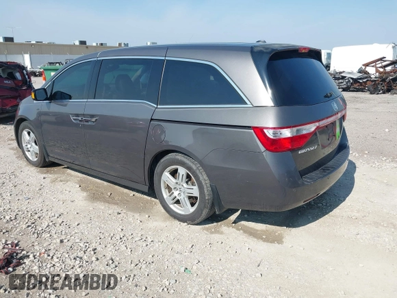 2013 Honda Odyssey Touring with VIN 5FNRL5H98DB080296, listed as a IAAI auction lot 42461843 with 104,901 mi miles and . Bid and sale history available at DreamBid. Image 3.