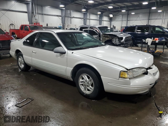 1997 Ford Thunderbird LX with VIN 1FALP6249VH167869, listed as a Copart auction lot 86851434 with 40,490 mi miles and Salvage Title. Bid and sale history available at DreamBid. Image 4.