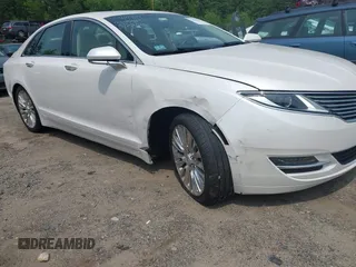 2015 Lincoln MKZ z VIN 3LN6L2G96FR625086, wystawiony jako IAAI lot #42406467 z przebiegiem 24 130 mil mil oraz . Historia ofert i sprzedaży dostępna na DreamBid. Obrazek 6.