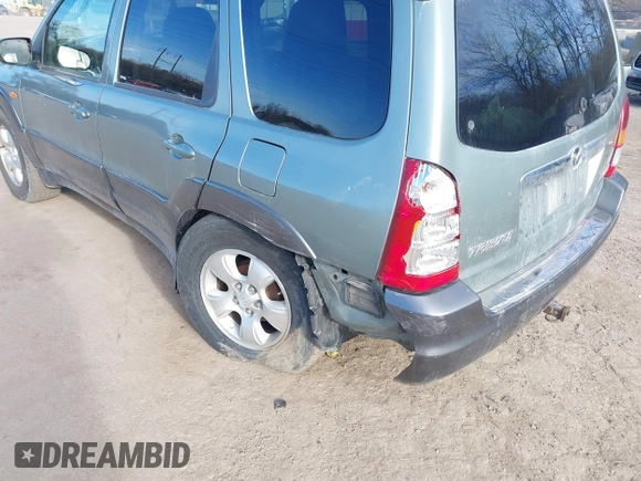 2003 Mazda Tribute ES with VIN 4F2CZ96133KM29066, listed as a IAAI auction lot 41581210 with 265,586 mi miles. Bid and sale history available at carsss.com. Image 6.