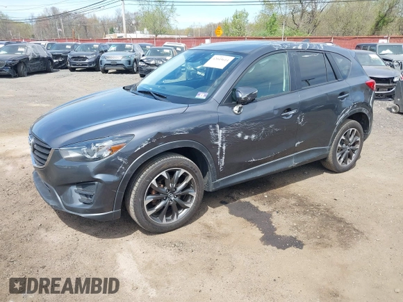 2016 Mazda CX-5 Grand Touring z VIN JM3KE4DY1G0893119, wystawiony jako IAAI lot #42049614 z przebiegiem 102 506 mil mil oraz . Historia ofert i sprzedaży dostępna na DreamBid. Obrazek 18.