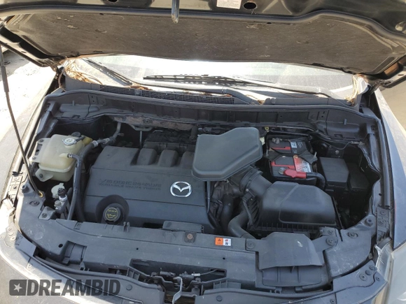 2015 Mazda CX-9 Sport z VIN JM3TB2BAXF0447315, wystawiony jako Copart lot #60842505 z przebiegiem 122 281 mil mil oraz Szkoda całkowita • Salvage title. Historia ofert i sprzedaży dostępna na DreamBid. Obrazek 12.
