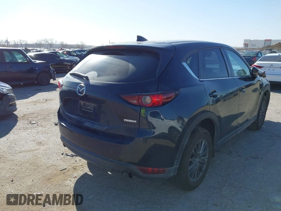 2020 Mazda CX-5 Touring with VIN JM3KFACM0L0780265, listed as a IAAI auction lot 41825873 with 151,888 mi miles. Bid and sale history available at carsss.com. Image 4.