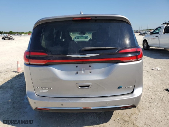 2021 Chrysler Pacifica Hybrid Touring L with VIN 2C4RC1L71MR594686, listed as a Copart auction lot 50885575 with 64,792 mi miles and Clean Title. Bid and sale history available at carsss.com. Image 6.