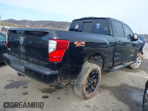 2018 Nissan Titan XD SV with VIN 1N6BA1F49JN521838, listed as a IAAI auction lot 41606878 with 143,742 mi miles. Bid and sale history available at carsss.com. Image 4.