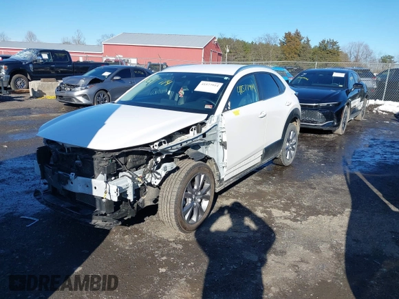 2022 Mazda CX-30 S Select z VIN 3MVDMBBL8NM448787, wystawiony jako IAAI lot #41577914 z przebiegiem 64 552 mil mil oraz . Historia ofert i sprzedaży dostępna na DreamBid. Obrazek 19.