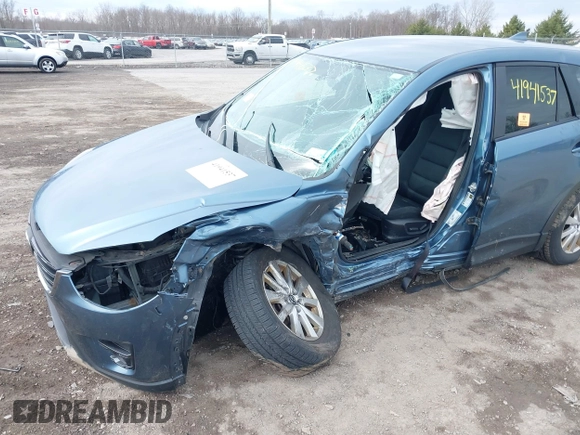 2016 Mazda CX-5 Touring with VIN JM3KE4CY8G0858045, listed as a IAAI auction lot 41941537 with 103,532 mi miles. Bid and sale history available at carsss.com. Image 6.