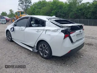2021 Toyota Prius L Eco with VIN JTDKAMFU6M3137679, listed as a IAAI auction lot 42488129 with 52,414 mi miles and . Bid and sale history available at DreamBid. Image 3.