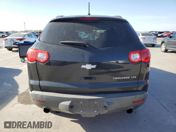 2012 Chevrolet Traverse LTZ z VIN 1GNKRLED7CJ261692, wystawiony jako Copart lot #49294845 z przebiegiem 207 616 mil mil oraz Czysty tytuł • Clean title. Historia ofert i sprzedaży dostępna na DreamBid. Obrazek 6.