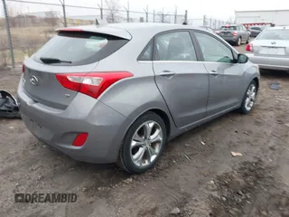 2013 Hyundai Elantra GT with VIN KMHD35LE0DU148382, listed as a IAAI auction lot 41898768 with 77,673 mi miles. Bid and sale history available at carsss.com. Image 4.