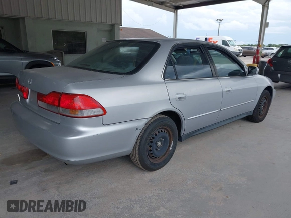 2001 Honda Accord LX with VIN 1HGCG55401A063548, listed as a IAAI auction lot 42651792 with 215,058 mi miles and . Bid and sale history available at DreamBid. Image 4.