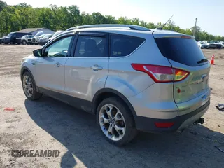 2016 Ford Escape Titanium with VIN 1FMCU9J97GUB91966, listed as a IAAI auction lot 42378829 with 121,218 mi miles and . Bid and sale history available at DreamBid. Image 3.