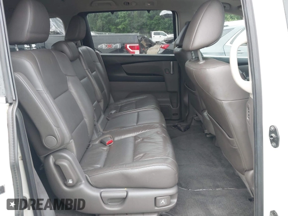 2012 Honda Odyssey Touring with VIN 5FNRL5H93CB034485, listed as a IAAI auction lot 42304502 with 198,589 mi miles and . Bid and sale history available at DreamBid. Image 8.