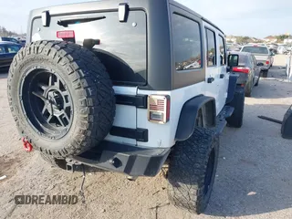 2017 Jeep Wrangler Unlimited Sport with VIN 1C4HJWDG1HL580136, listed as a IAAI auction lot 41193905 with 63,875 mi miles. Bid and sale history available at carsss.com. Image 4.