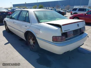 1996 Cadillac Seville Touring STS with VIN 1G6KY5298TU815539, listed as a IAAI auction lot 41665242 with 151,736 mi miles. Bid and sale history available at carsss.com. Image 3.
