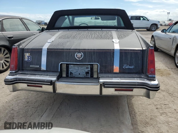 1985 Cadillac Eldorado z VIN 1G6EL578XFE614641, wystawiony jako Copart lot #75663984 z przebiegiem 54 128 mil mil oraz Szkody całkowita. Historia ofert i sprzedaży dostępna na DreamBid. Obrazek 6.