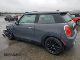 2014 MINI Hardtop S with VIN WMWXM7C54ET985344, listed as a Copart auction lot 52012465 with 87,017 mi miles and Salvage title. Bid and sale history available at DreamBid. Image 2.